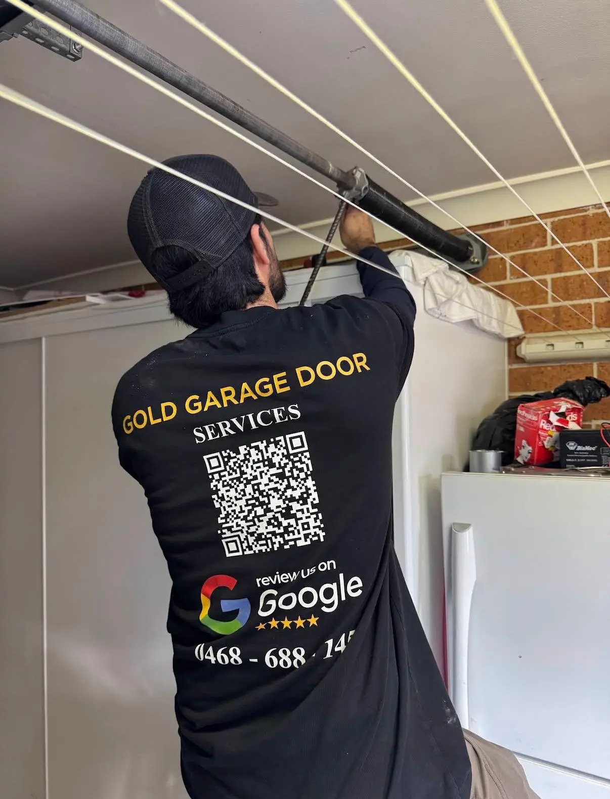 Garage door spring replacement in progress, Sydney technician
