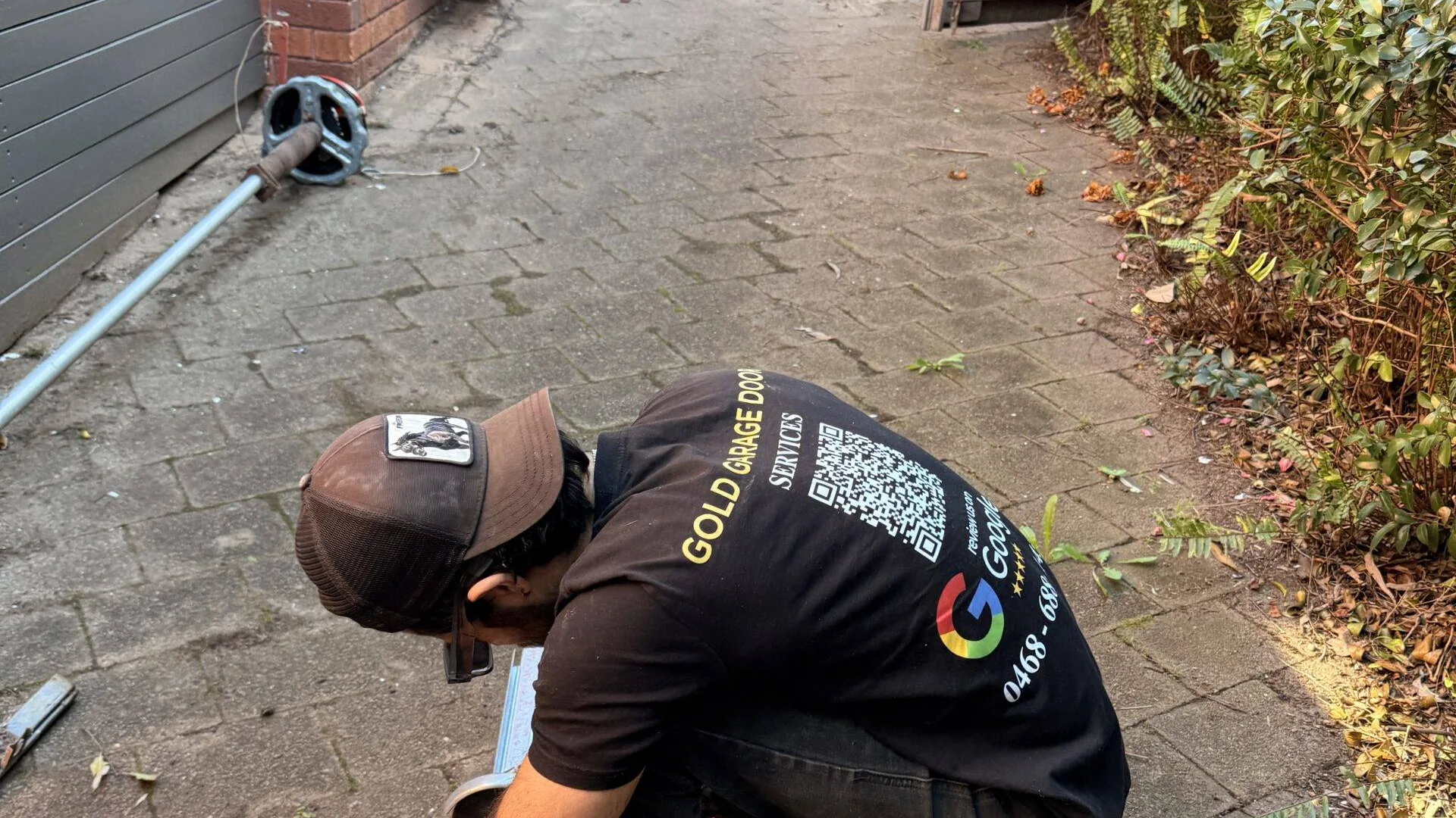 Gold Garage Door technician servicing a garage door motor and opener in Sydney